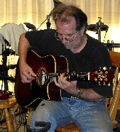 Clyde Schipke on acoustic guitar